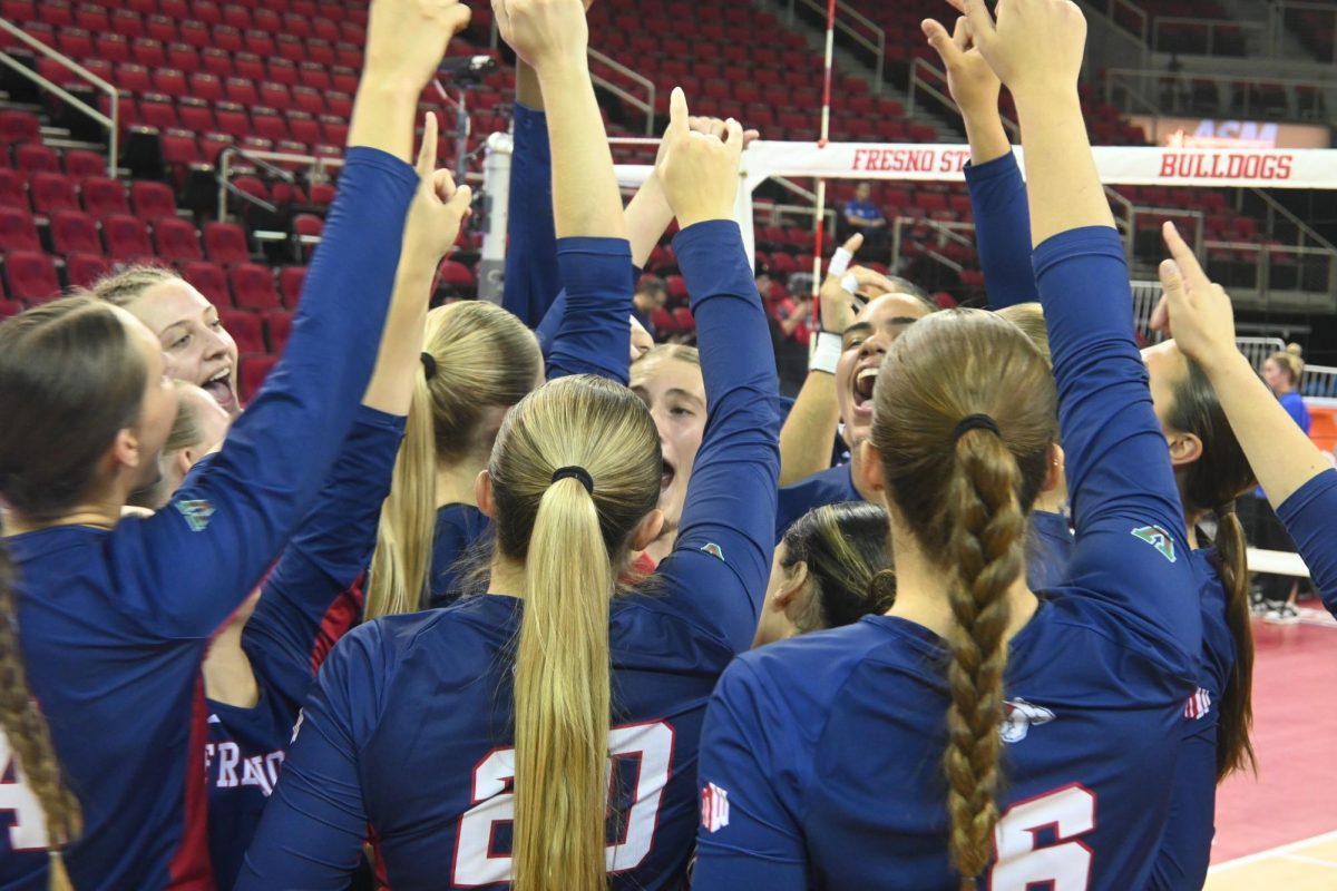 The Fresno State women's volleyball team celebrates after completing a reverse sweep against Boise State on Sept. 26, 2024 at the SaveMart Center. 