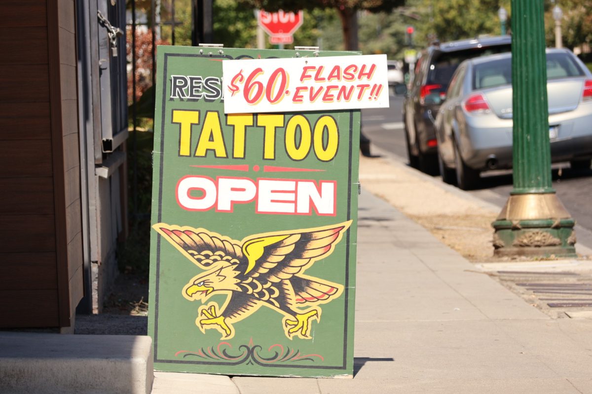 Promotional sign for Resistance Tattoo's fundraiser event on Sept. 22, 2024.