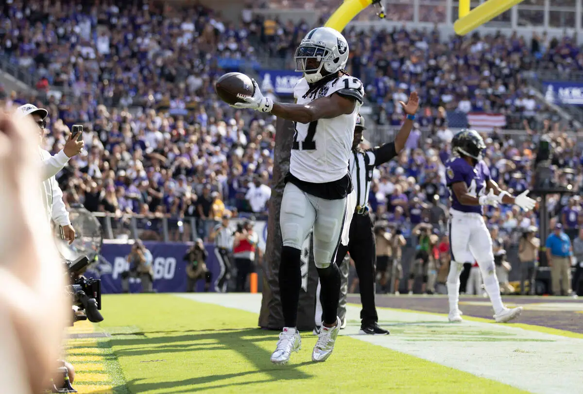 Raiders wide receiver Davante Adams posing with the football after catching a touchdown against the Baltimore Ravens on September 15, 2024.