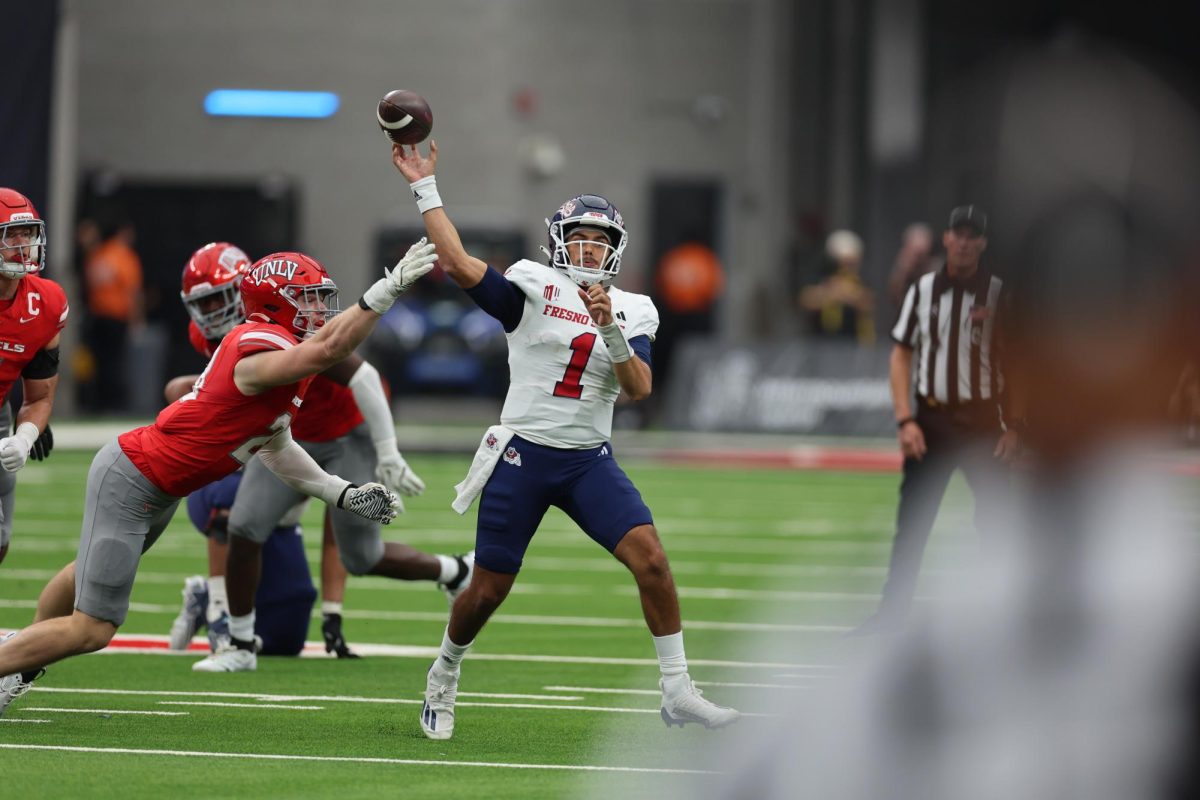 Quarterback Mikey Keene throwing on the run against UNLV at Allegiant Stadium on Sept. 28, 2024. 