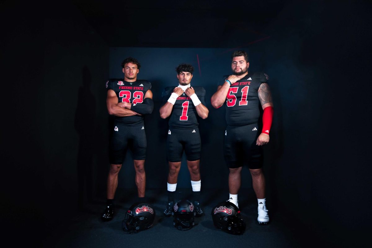 Dean Clark (32), Mikey Keene (1) and Mose Vavao (51) wearing the all-black uniforms which will be used on Saturday, October 26 against San Jose State. 