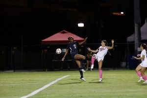 Senior forward Kaelyn Miller kicks a ball under the night skies at Bulldog Soccer Stadium on October 10, 2024. 