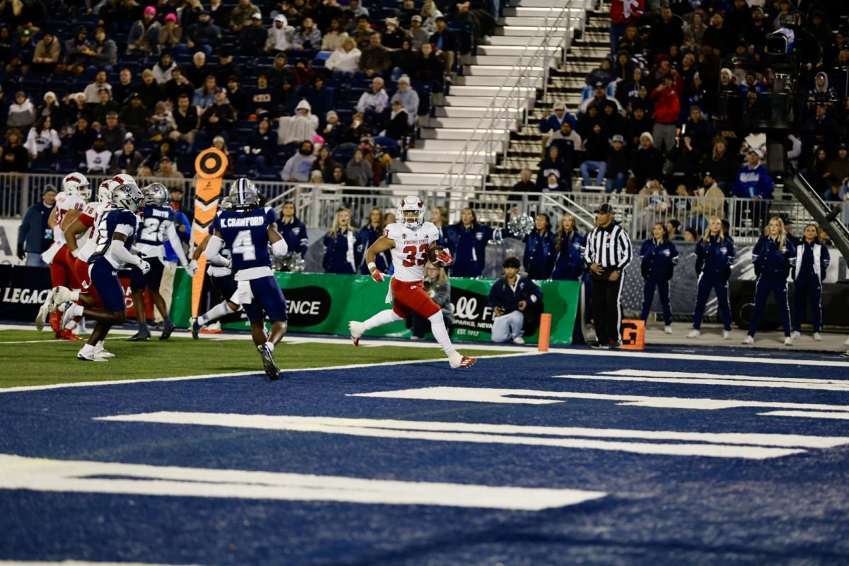 Bulldog running back Elijah Gilliam runs the ball into the end zone against the Wolf Pack at Mackay Stadium, on Oct. 18.