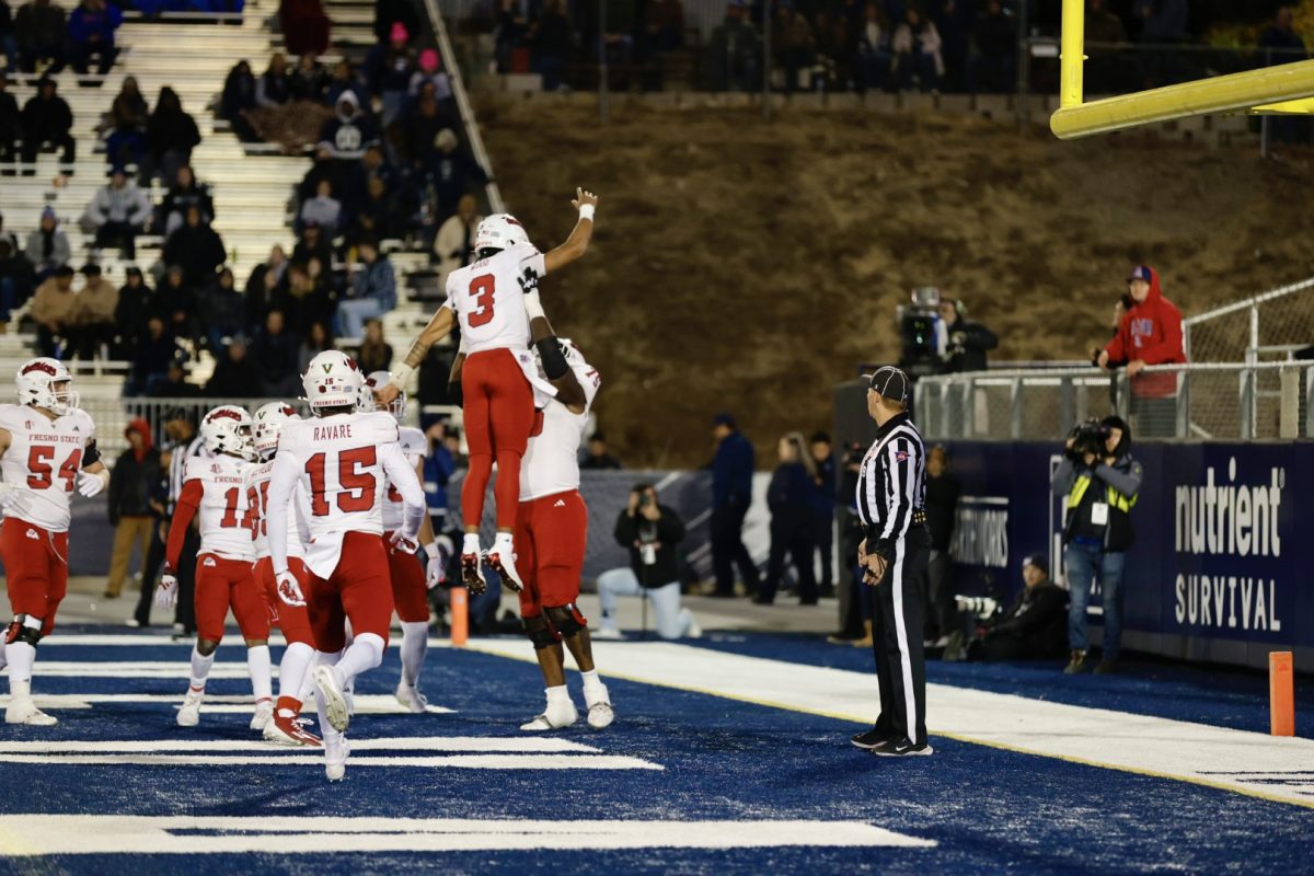 Quarterback Joshua Wood (3) is hoisted up in the air after rushing for a touchdown in the Bulldogs 24-21 victory over Nevada on Friday, October 18, 2024, at Mackay Stadium in Reno, Nevada.