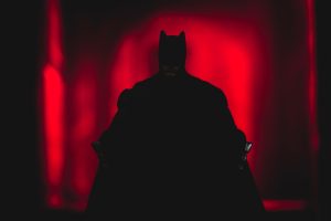 Shadow of DC Comics caped crusader Batman in an alleyway of Gotham City - Mattel action figure.