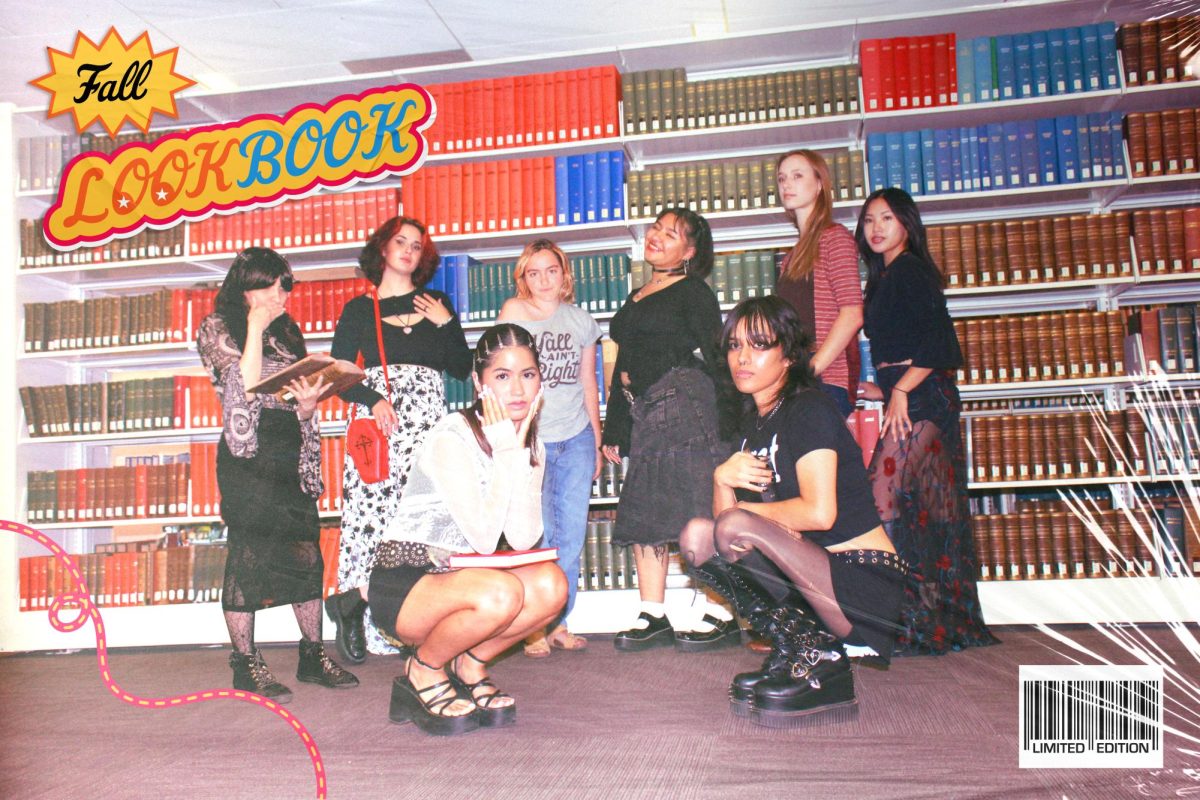 Fashion Inc. models pose for a group picture at the Fresno State Libary. 