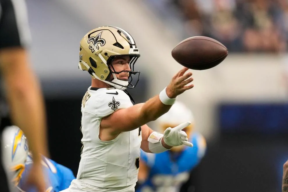 New Orleans Saints quarterback Jake Haener (3) passes in the second half of an NFL football game against the Los Angeles Chargers in Inglewood, Calif., Sunday, Oct. 27, 2024. 