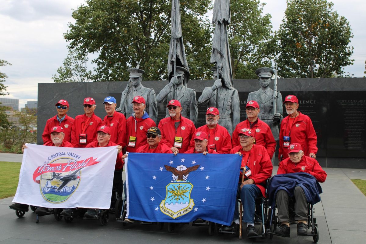 United States Air Force veterans hold up flags at the Air Force Memorial on Oct. 15. 