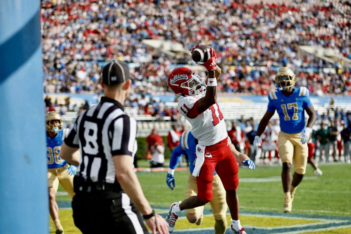 Wideout Raylen Sharpe (11) catching a touchdown in the second quarter against the UCLA Bruins on Nov. 30, 2024, at the Rose Bowl. 