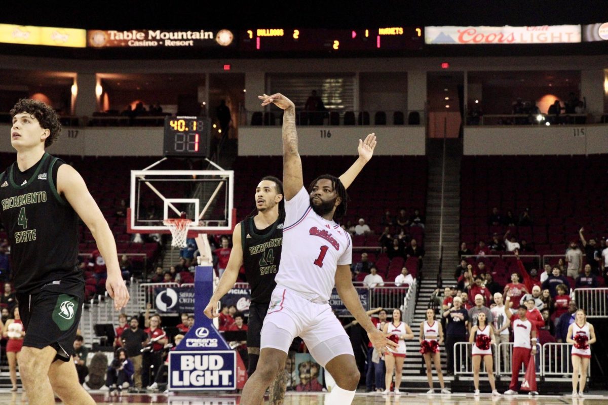 Amar Augillard with a three-pointer in the final minute to seal Fresno State's 64-57 victory over Sacramento State on Nov. 8, 2024, at the Save Mart Center.