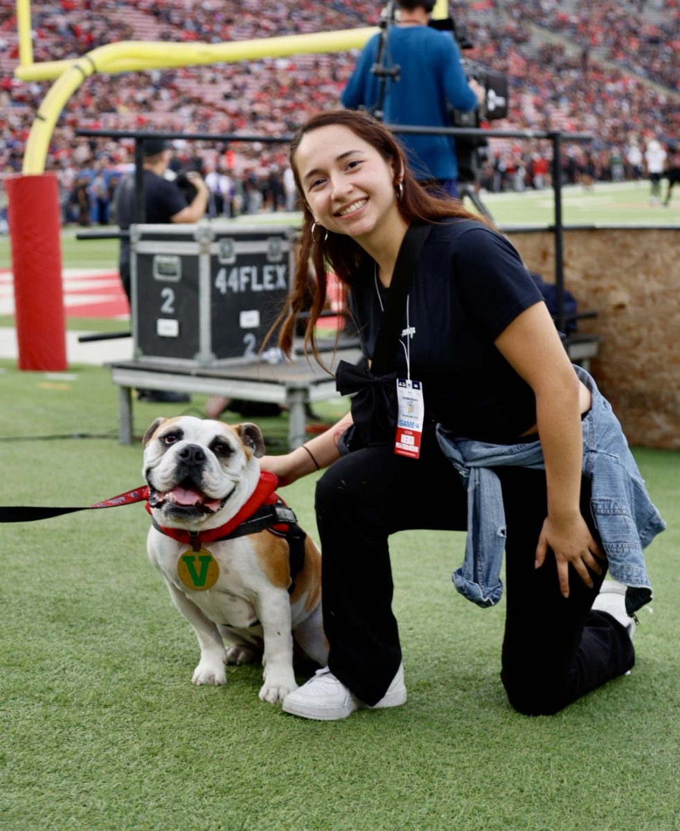 Camille Amezcua takes a picture with Victor E. IV at Valley Children's Stadium on Saturday, October 26, 2024, at Homecoming. 