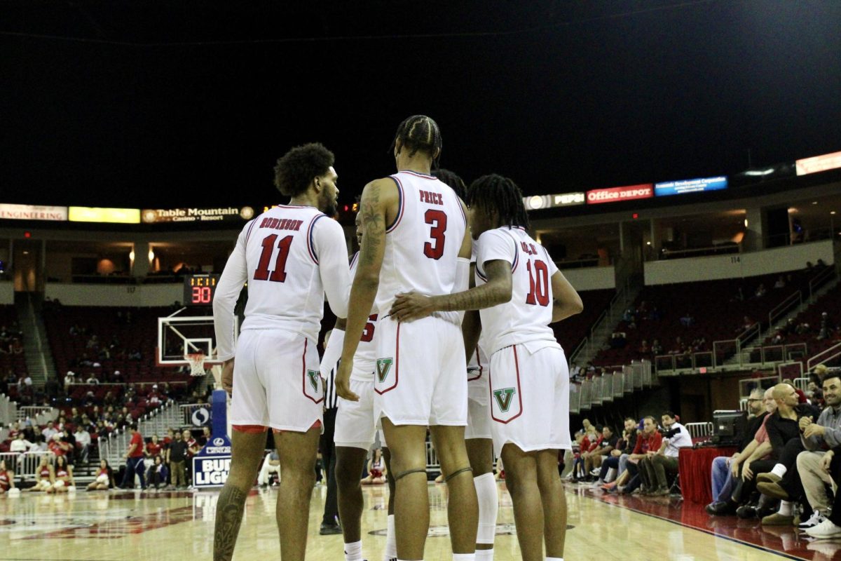 Fresno State players huddling together during the win against Sacramento State on Friday, Nov. 8, at the Save Mart Center.