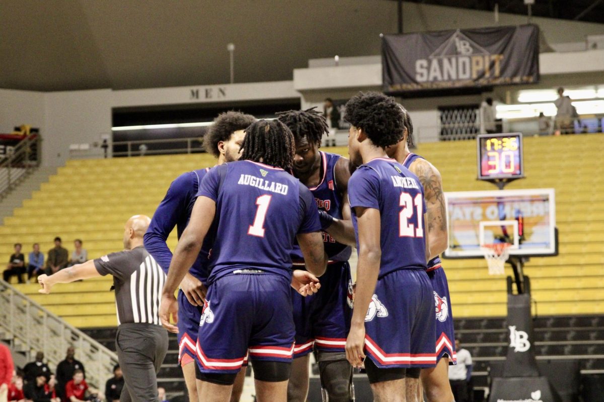 The Fresno State men's basketball team huddles up at the Walter Pyramid Court on Nov. 23, 2024, in a win over Long Beach State. 