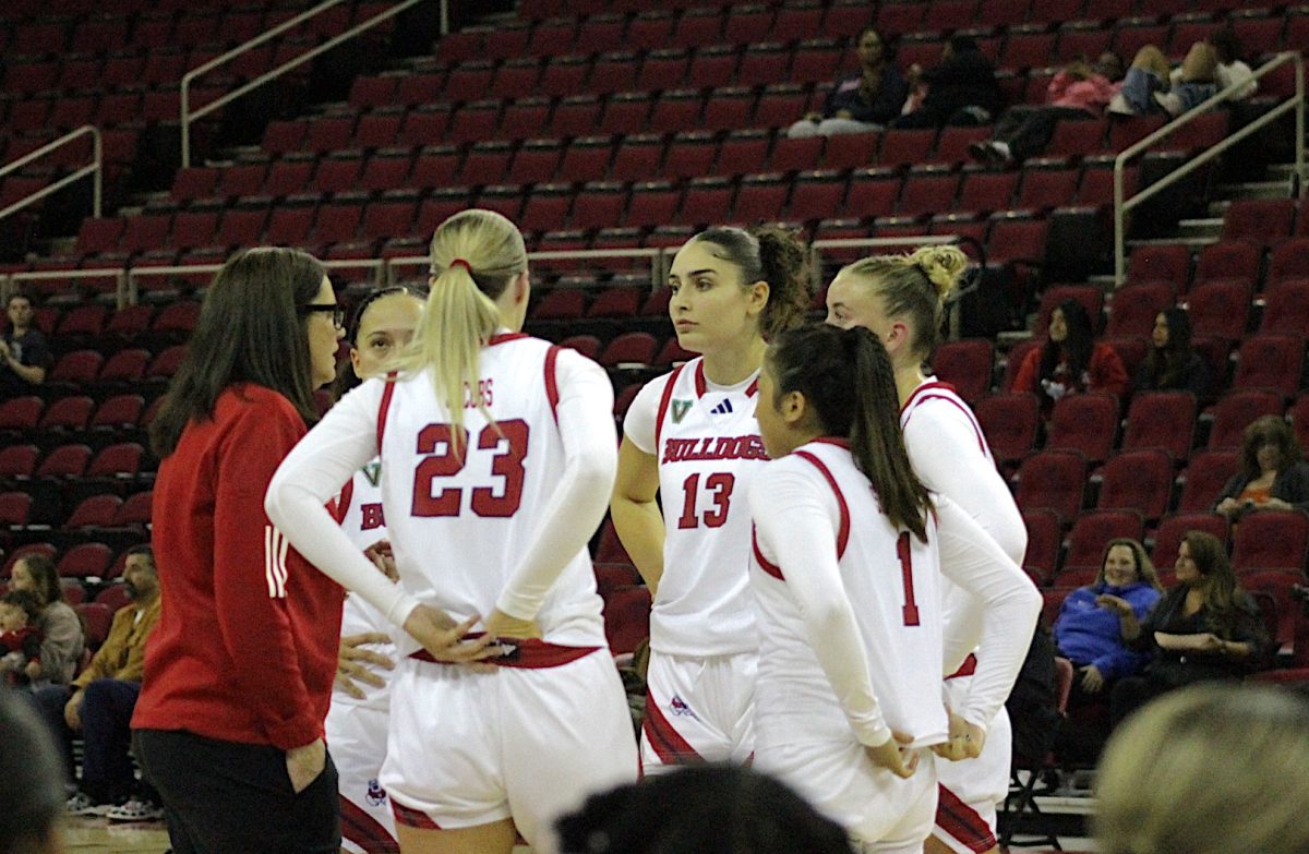 Head Coach Jaime White talks to her team during a timeout in the Bulldogs 72-46 victory over Fresno Pacific on Monday, November 6, 2024. 