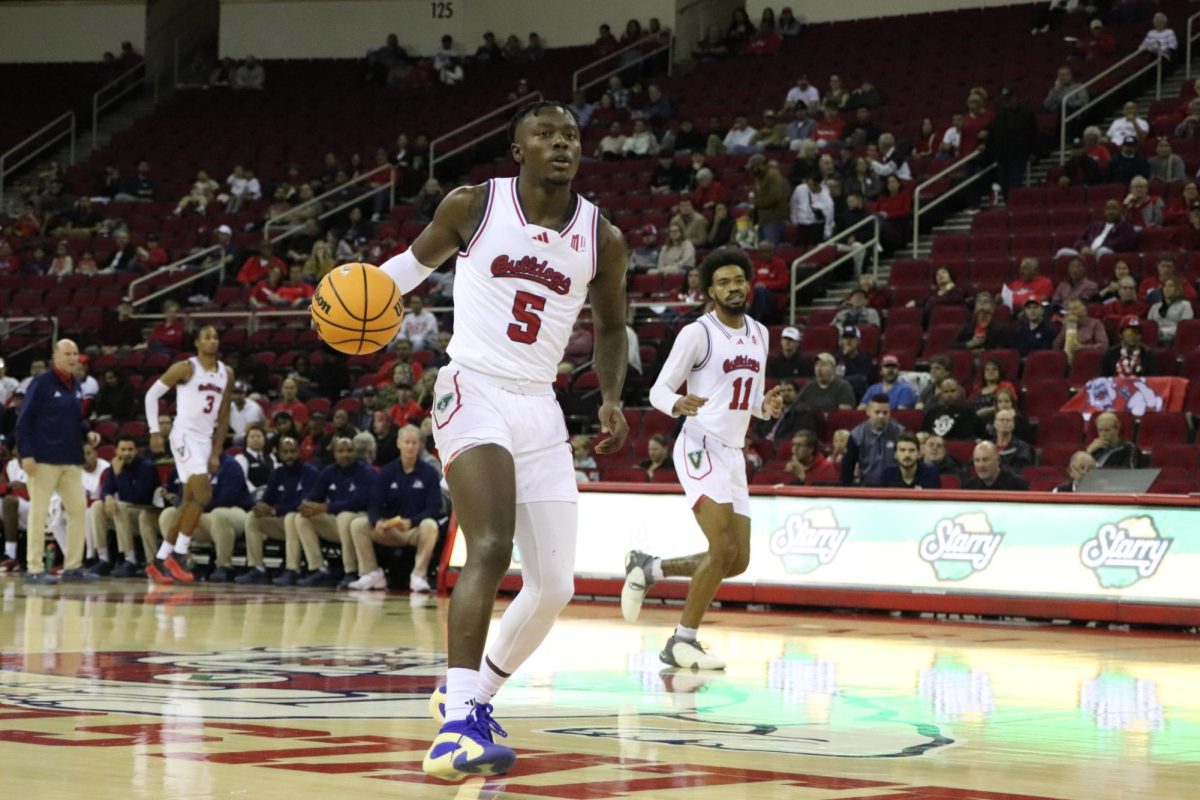 Forward Jalen Weaver (5) dribbles the ball up the court against Prairie View A&M on Nov. 20, 2024, at the Save Mart Center. 