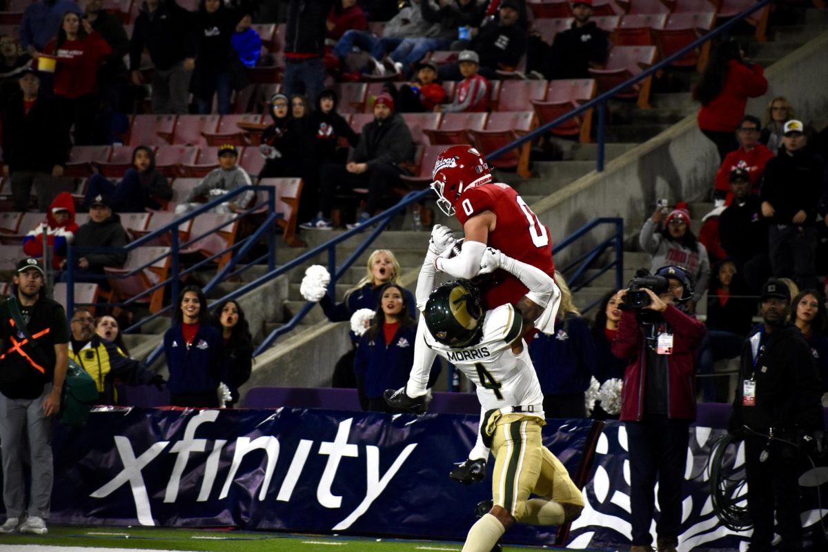 Senior wideout Mac Dalena (0) with a jumping grab towards the end of the first half for a touchdown on Nov. 23, 2024, at Valley Children's Stadium. 