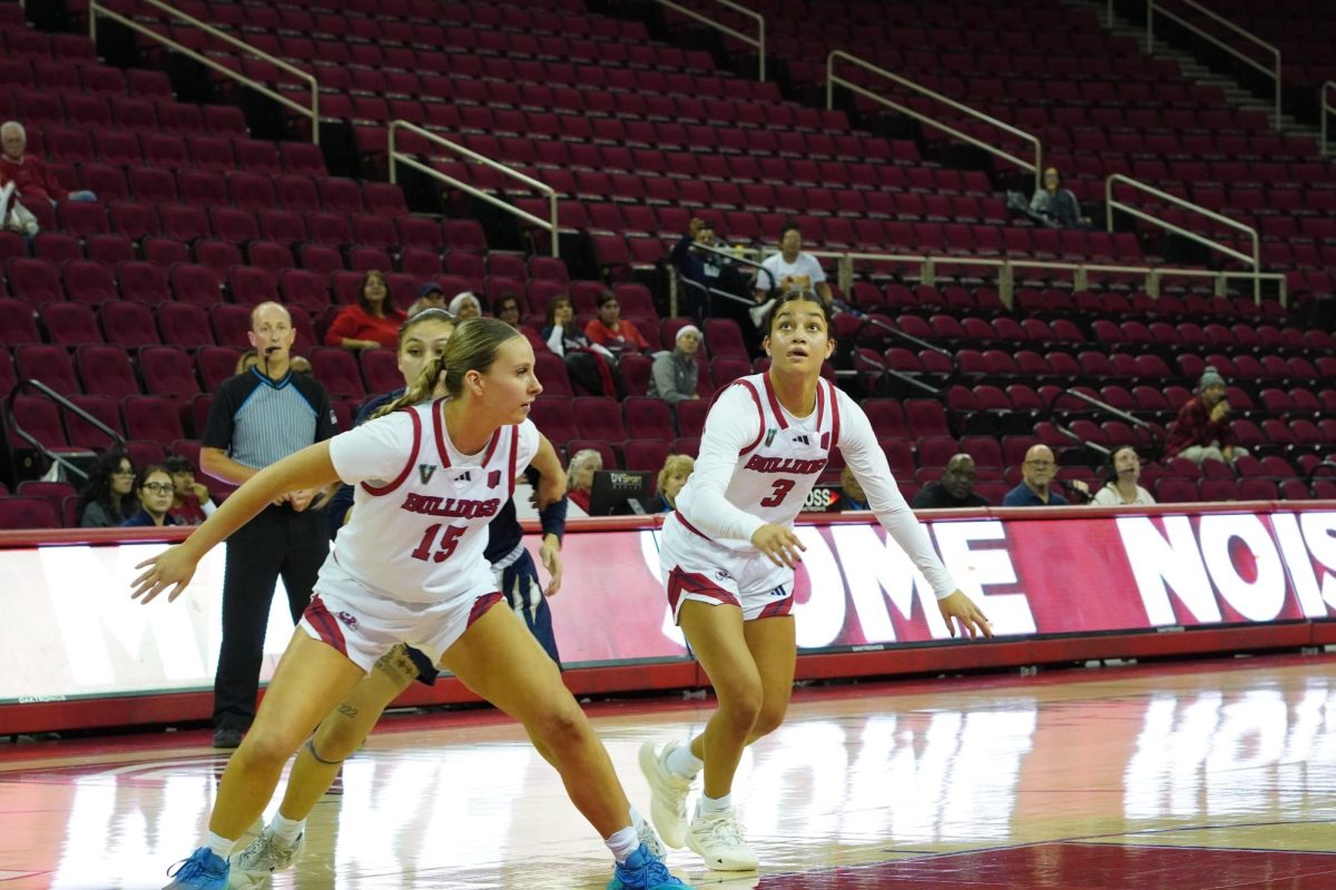 Laney Amundson (15) and Danae Powell (3) look to grab a rebound in the second half against UC Merced at the Save Mart Center on Dec. 5, 2024. 