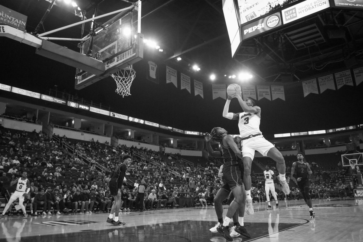 Elijah Price (3) driving to the basket against San Diego State on Wednesday, Dec. 4, 2024, at the Save Mart Center. 