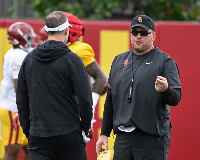  Head coach Lincoln Riley along with Linebackers coach Matt Entz, right, of the USC Trojans during USC football spring practice at Howard Jones Field on the campus of the University of Southern California in Los Angeles on Thursday, April 4, 2024.