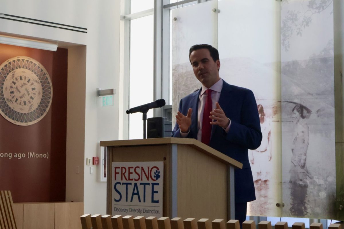 Robert Costa speaks to local media outlets about his time as chief election correspondent for CBS News on Dec. 2 at the Fresno State Library. 