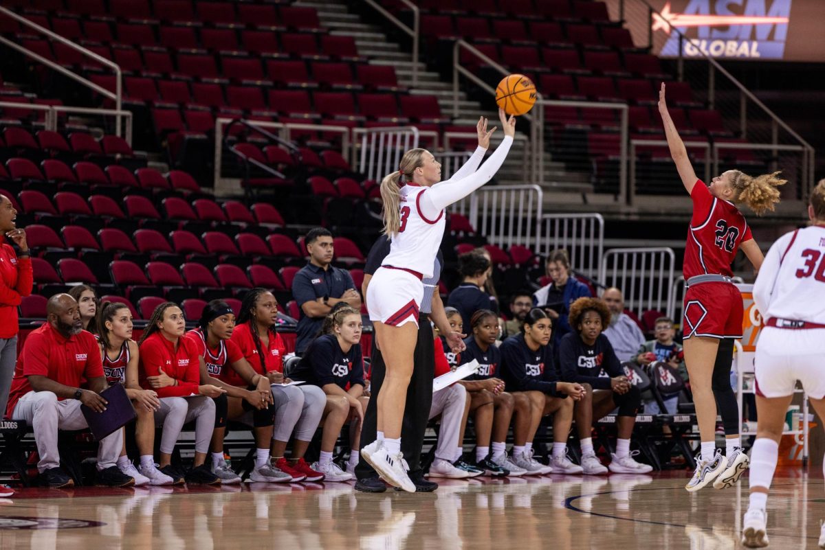 Mia Jacobs shoots a three in Fresno State's 90-73 win over Cal State University, Northridge at the Save Mart Center on Friday, Nov. 22, 2024. 