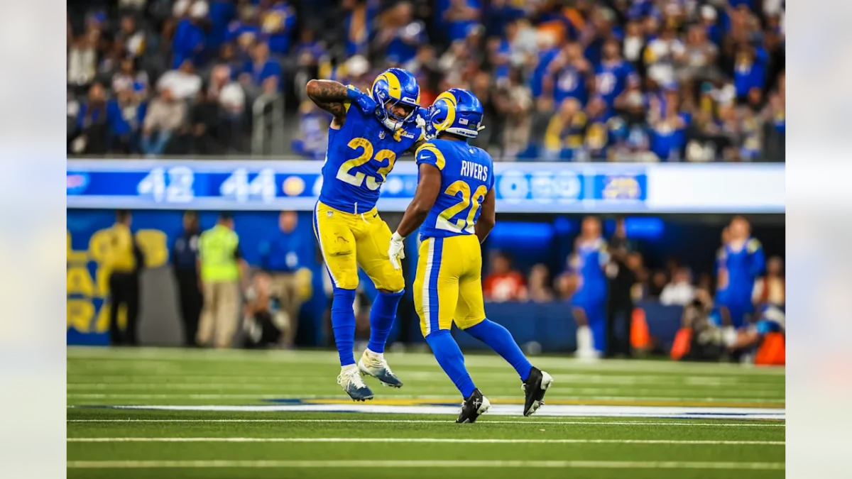 Ronnie Rivers (20) celebrates with fellow running back Kyren Williams during the Rams' 44-42 win over Buffalo on Sunday, Dec. 8, 2024. 