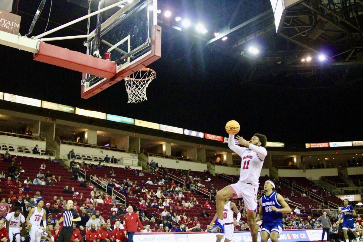 Bulldog forward Mykell Robinson jumps for one-handed dunk against the University of Nevada, Reno at the Save Mart Center on Jan. 11.