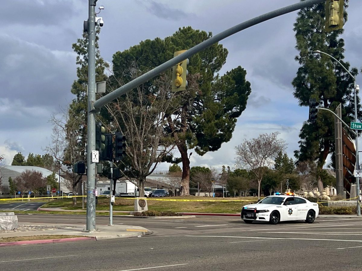 Police and caution tape around Fresno State on Jan. 26 by Shaw and Maple Avenues. 