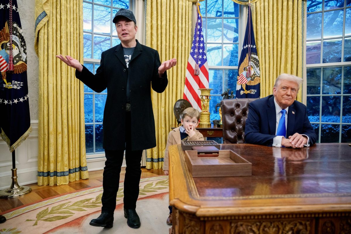 Tesla and SpaceX CEO Elon Musk, accompanied by U.S. President Donald Trump (R), and his son X Musk, speaks during an executive order signing in the Oval Office at the White House on Feb. 11, 2025, in Washington, DC. Trump is to sign an executive order implementing the Department of Government Efficiency's (DOGE) "workforce optimization initiative," which, according to Trump, will encourage agencies to limit hiring and reduce the size of the federal government.