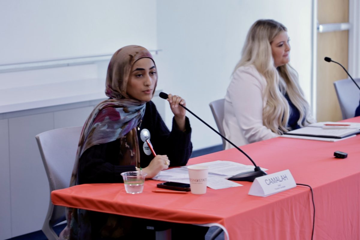 Camalah Saleh and Carlie Hall speak during Associated Students, Inc. presidential debate on March 24. 