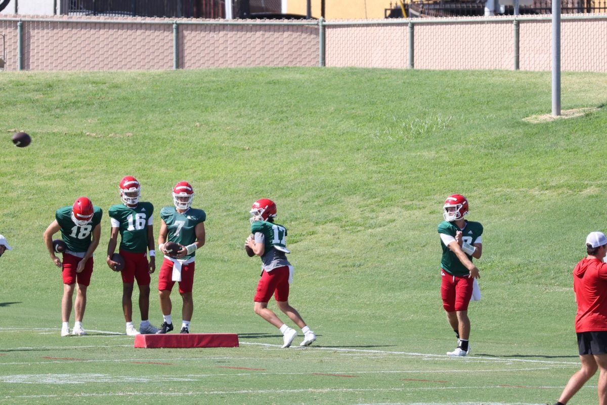 The Fresno State quarterback room doing drills during practice on August 11.