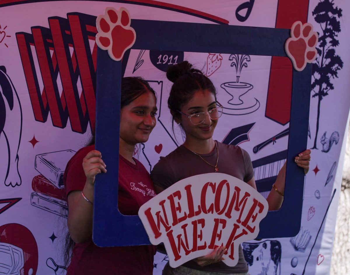 Students pose at the photo booth at "Big Bulldog Welcome." 