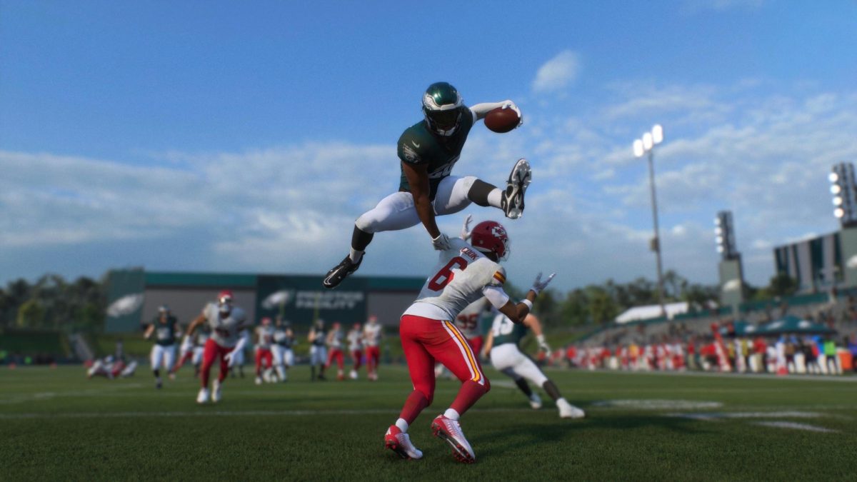Philadelphia Eagles running back Saquon Barkley hurdling Kansas City Chiefs defender.