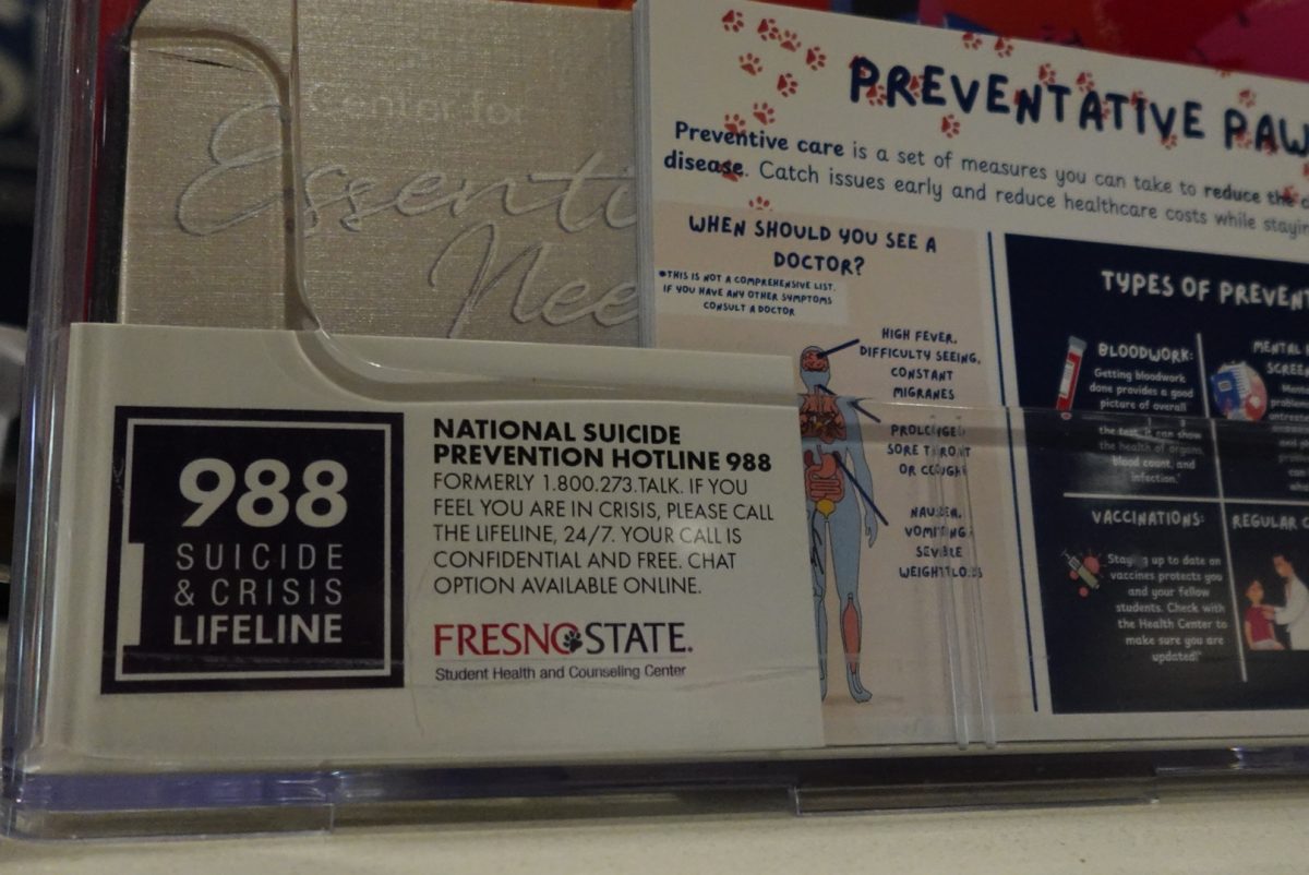 Cards displaying the suicide and crisis lifeline number at the Student Health and Counseling Center on Sept. 4.