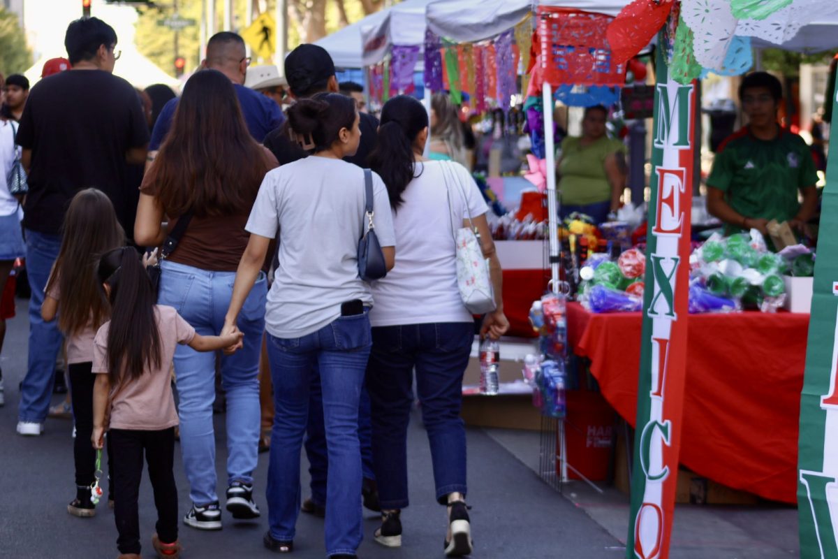 People walk in Downtown Fresno at the Fiestas Patrias celebration on Sept. 14.