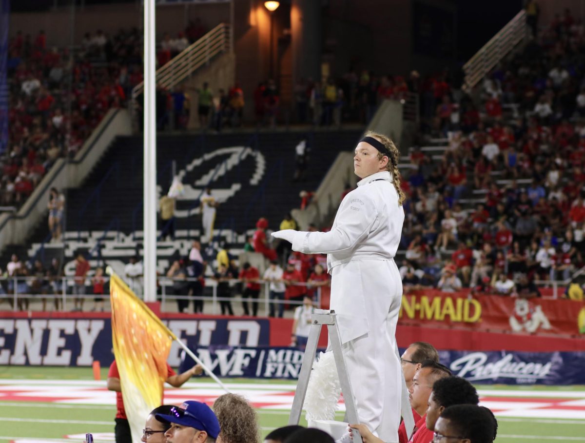 Fresno State Bulldog Marching Band drum major conducts during halftime on Sept. 13 at Valley Children's Stadium.