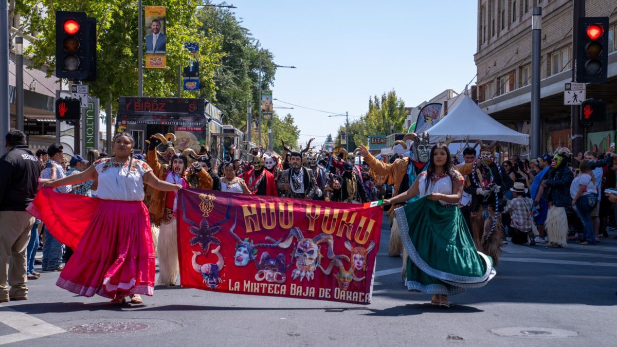 People march in the Fiestas Patrias celebration in Downtown Fresno on Sept. 14.