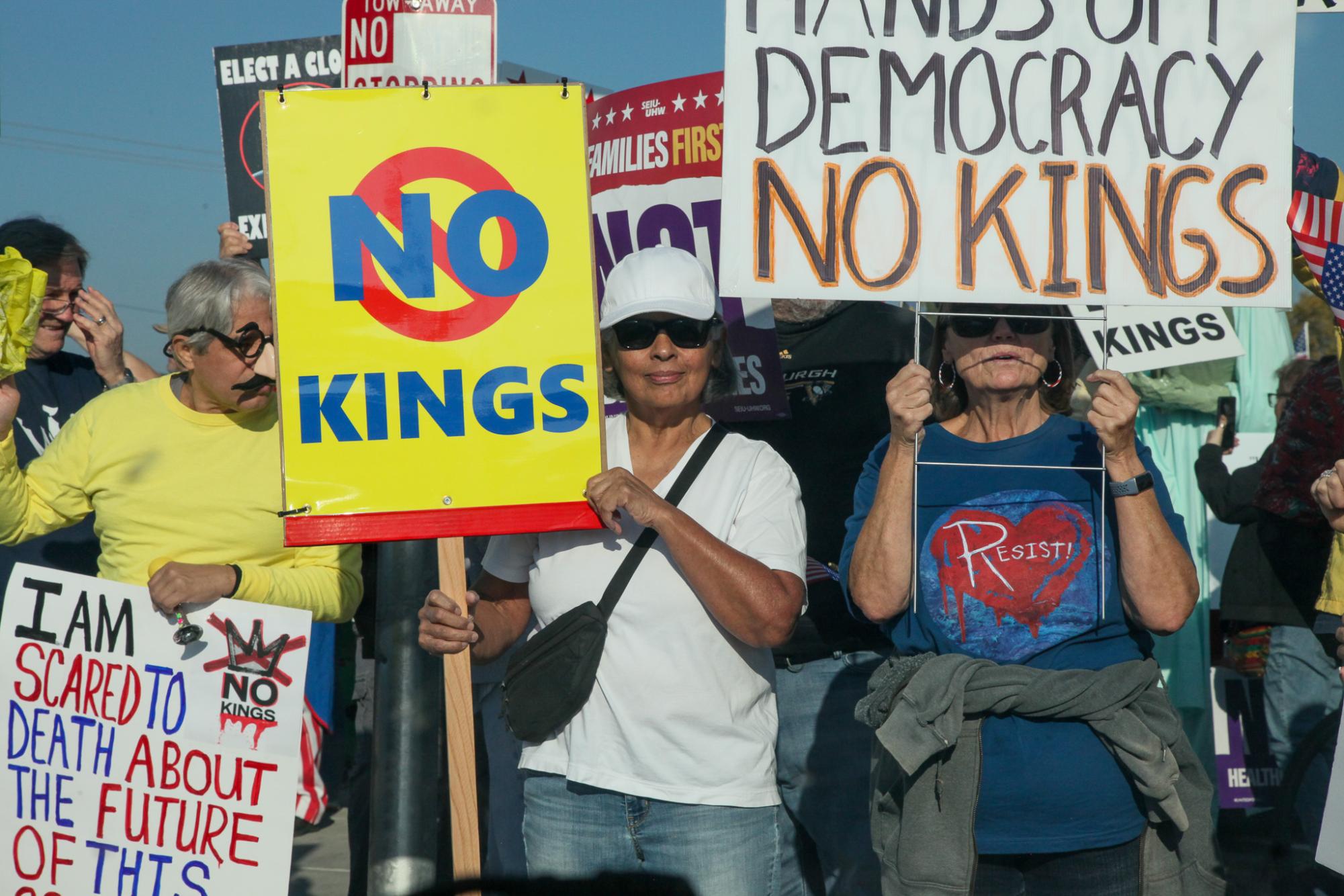 Residents standing in solidarity for No Kings Day on Oct. 18. 