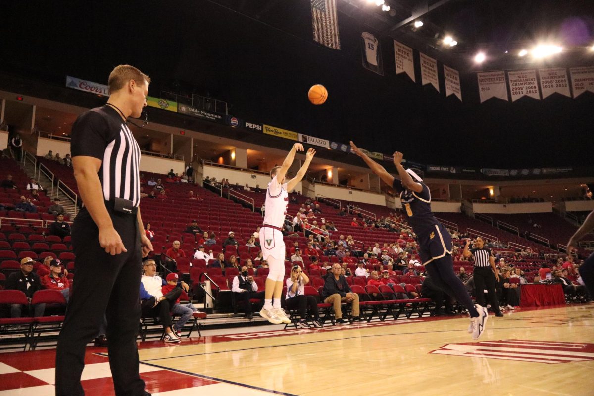 Fresno State guard Jake Heidbreder launches a 3-pointer over a Triton defender at the Save Mart Center on Nov. 12. 