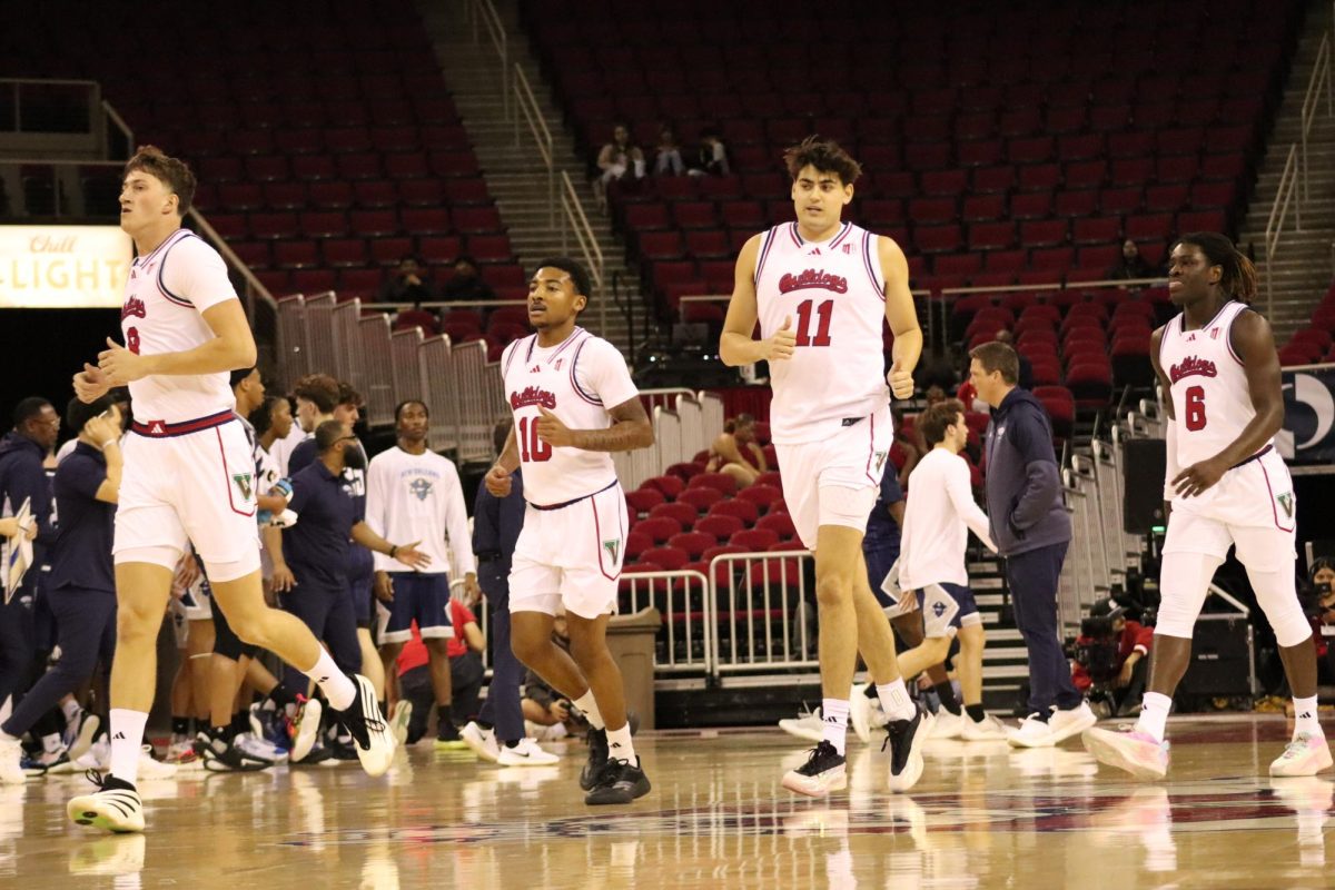 From left to right, Gasper Kocevar (9), Zaon Collins (10), Jac Mani (11) and DJ Stickman (6) jog off the court after a timeout was called on the court during a game against the New Orleans Privateers at the Save Mart Center on Nov. 21.