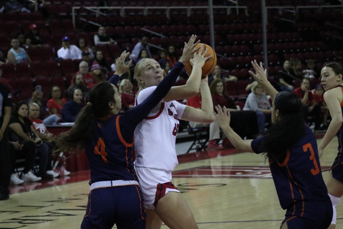 Hedda Koehne goes up for a layup against two Sunbird defenders in the first quarter.