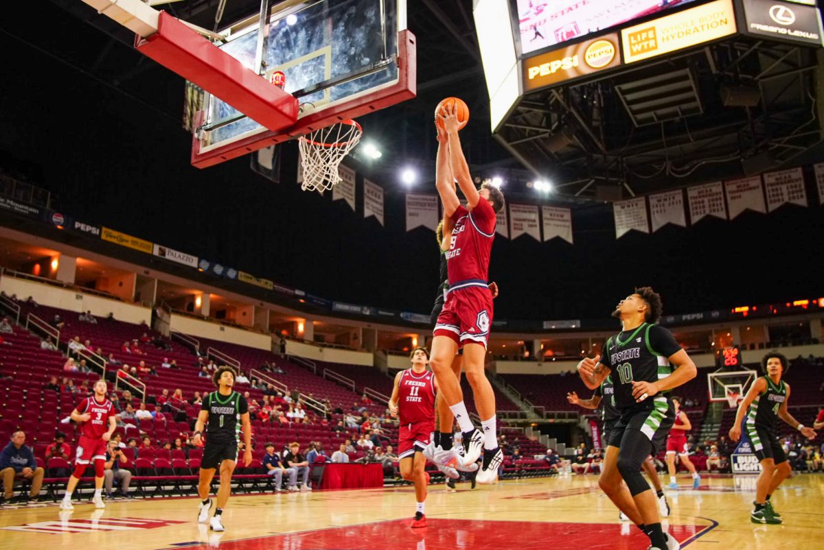 Gašper Kočevar goes up for a two-hand dunk.