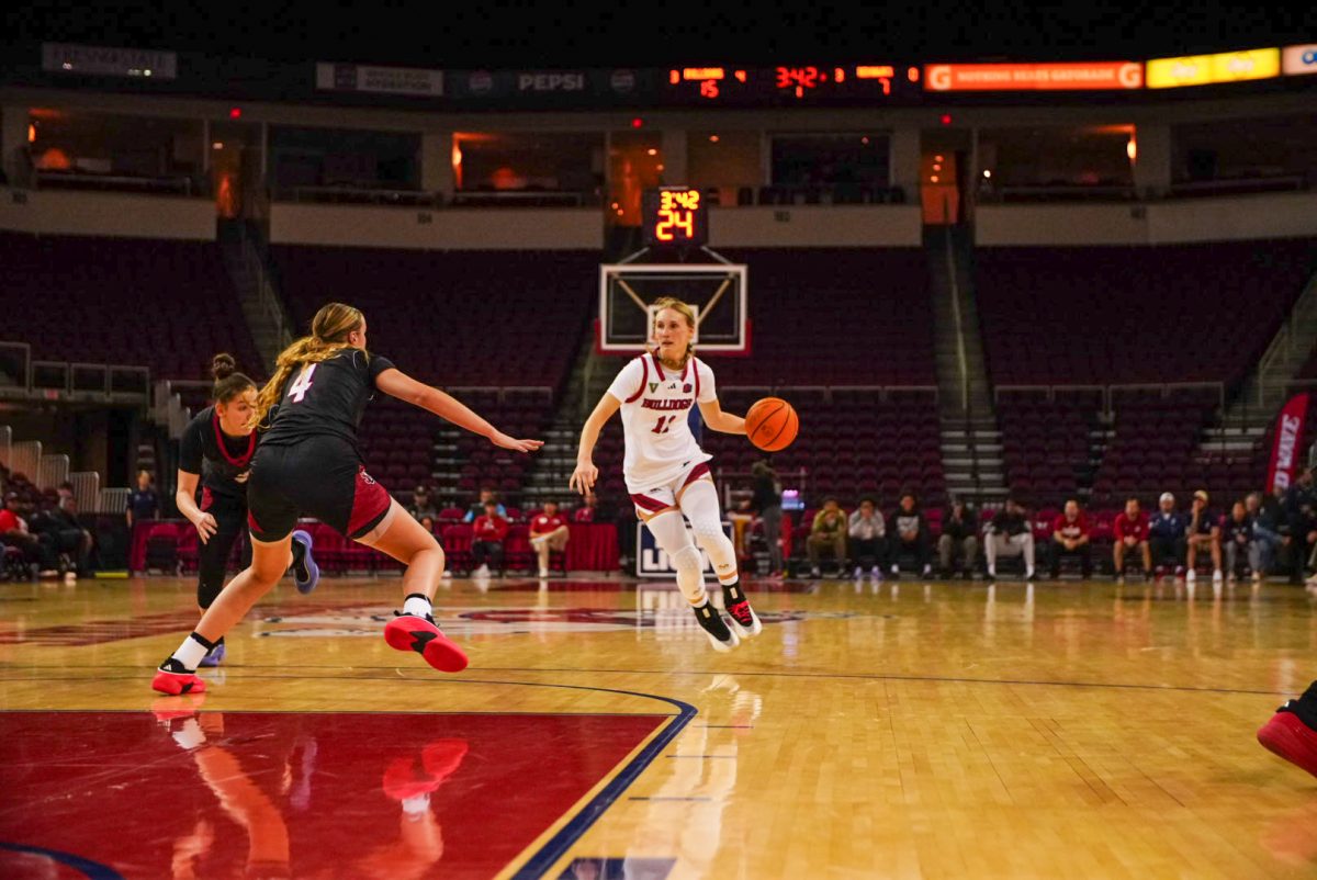 Bulldogs guard Emilia Long dribbles at the top of the key.