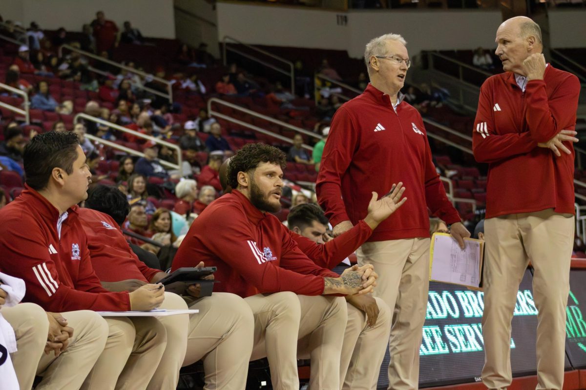 Fresno State men's basketball coaches talk during a break in the action against the against the New Orleans Privateers on Nov. 21 at the Save Mart Center.