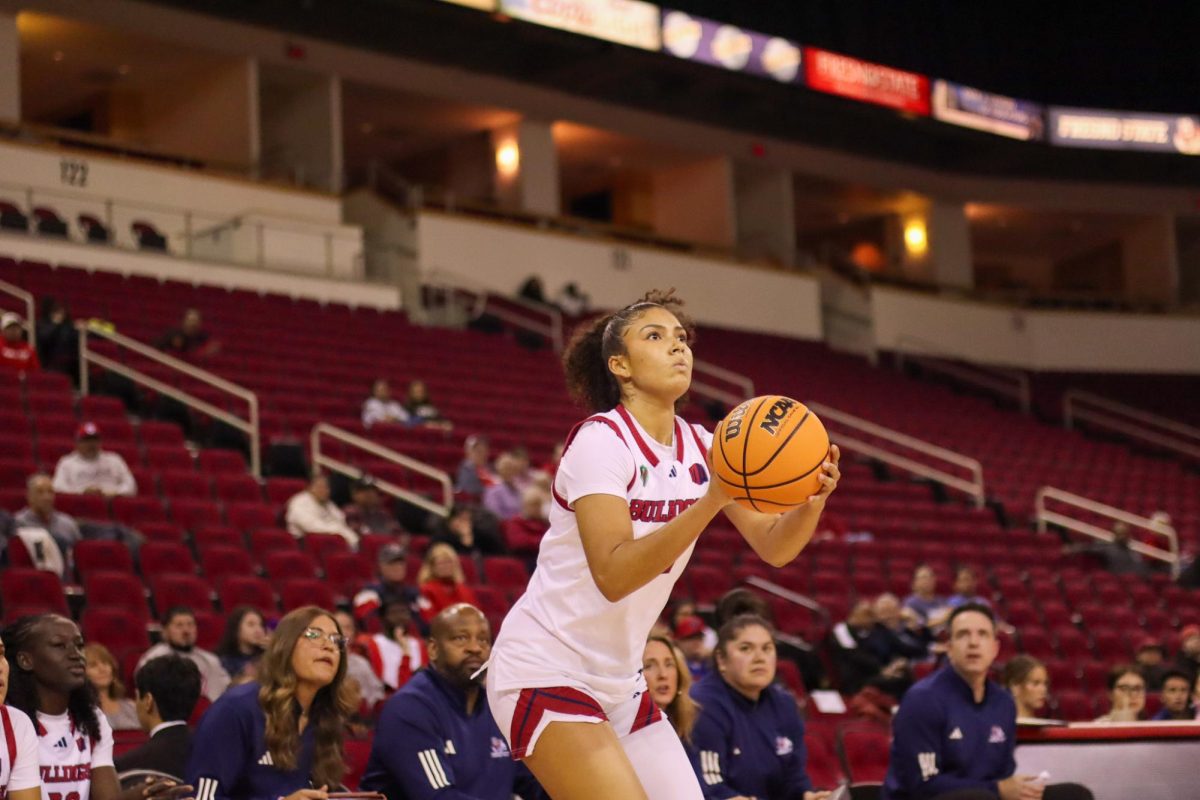 Bulldogs' forward Avery Watkins goes up for a 3-pointer in the fourth quarter against the San Diego State Aztecs on Dec. 17 at the Save Mart Center. Watkins reeled in a double-double in a 10-point loss to the Aztecs.