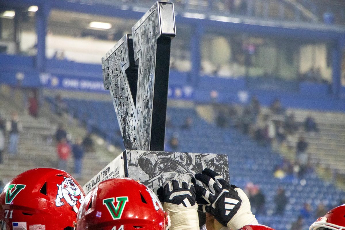 The Fresno State football team raises the Valley Trophy after beating the San Jose State Spartans 41-14 at CEFCU Stadium on Nov. 29.