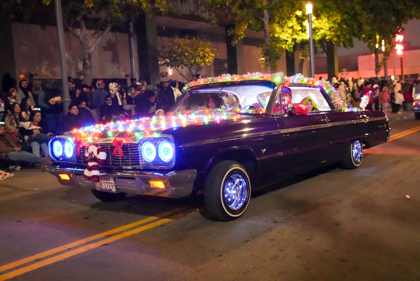  A low rider car club showing off their builds with Christmas lights for the parade on Dec. 13.