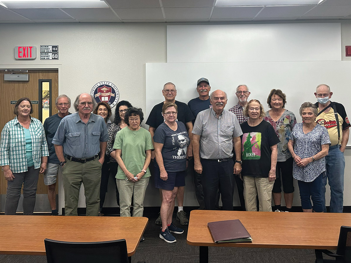 Prof. Barlow Der Mugrdechian, sixth from right, with members
of the Osher Lifelong Learning class.
