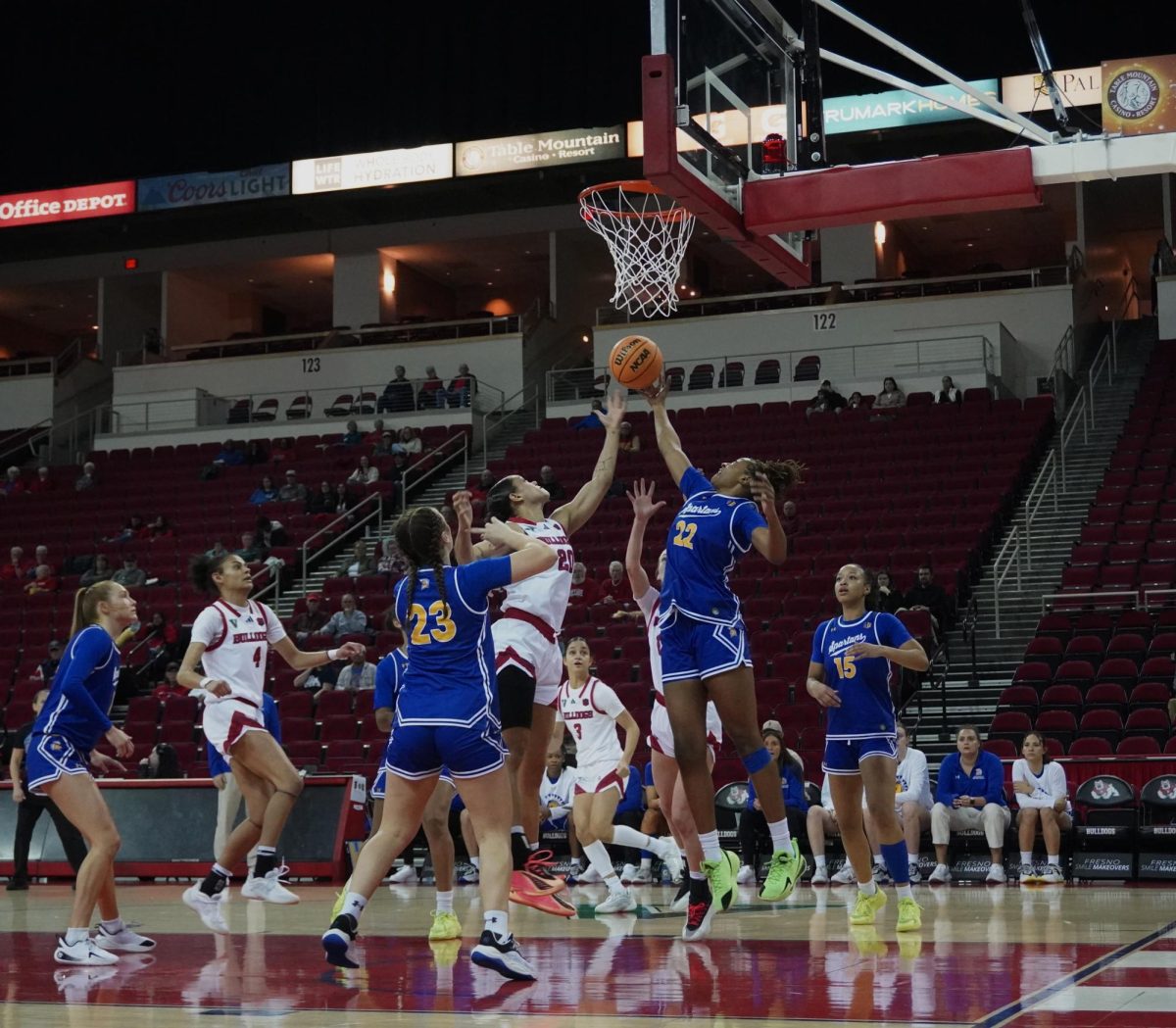 Bulldogs' guard Indiya Clarke (20) goes for a layup on the low block as a San Jose State defender attempts to block her shot on Jan. 7 at the Save Mart Center.