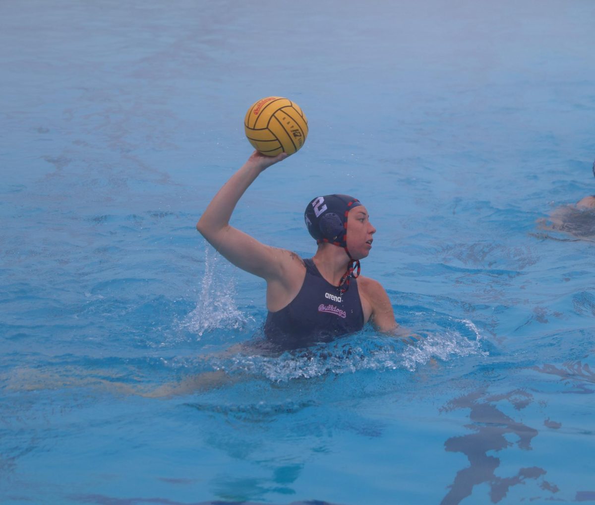 Bulldogs' attacker Hailey Andress holds the ball up in anticipation of a shot against the San Jose State Spartans on Jan. 18 at the Fresno State Aquatics Center. With two goals in the game. Andress became the first Bulldog in 2026 to eclipse the double-digit goal mark.